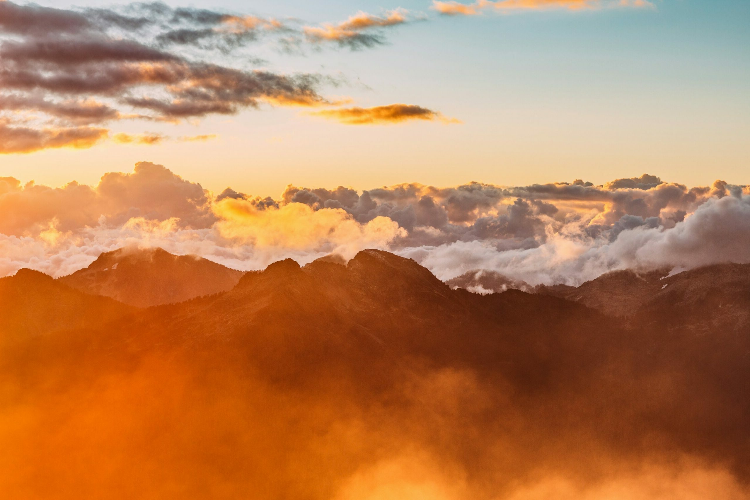 Orange clouds over mountains